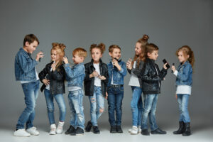 The studio shot of group of children with mobile phones